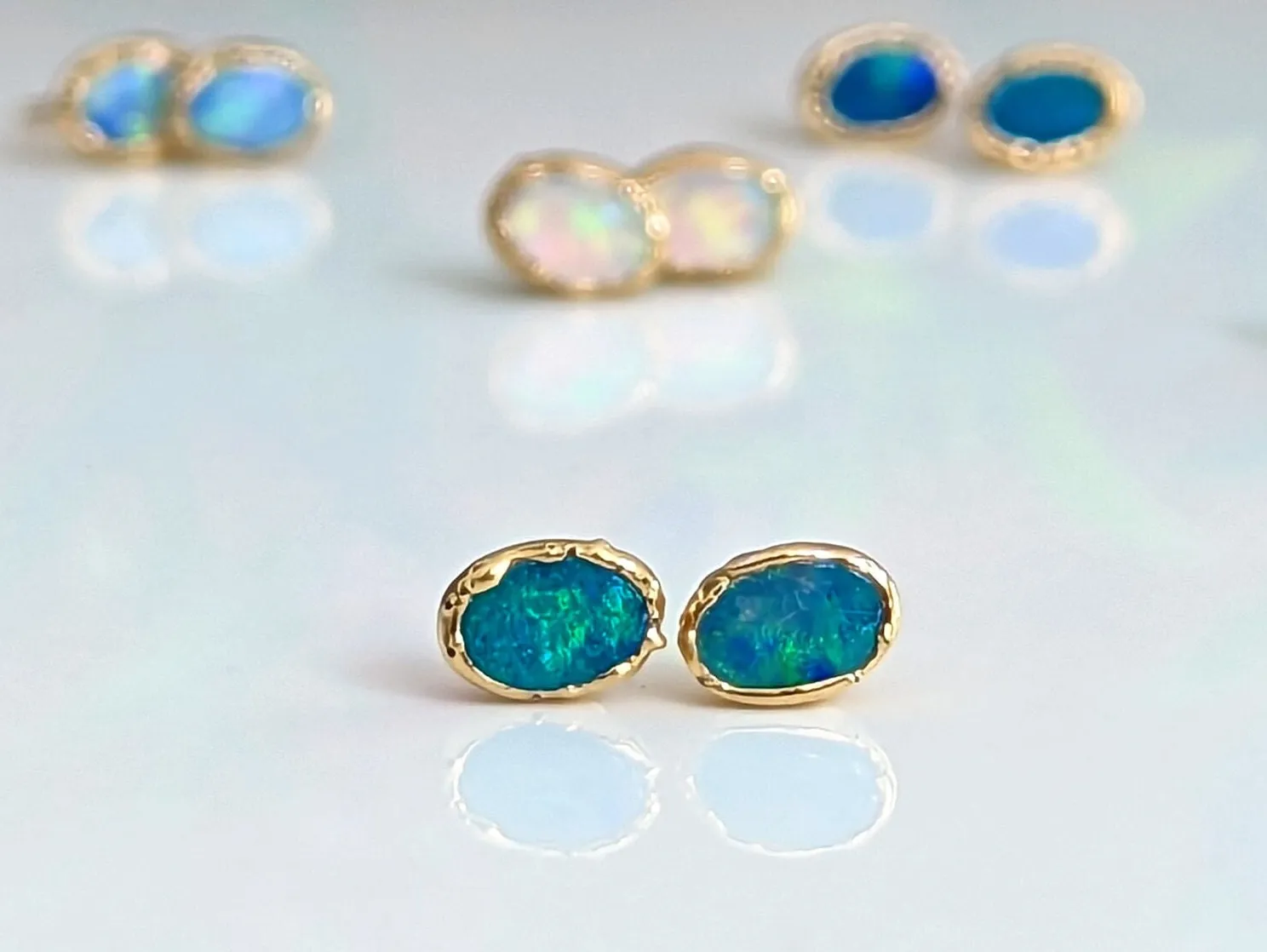 Blue Australian Opal stud earrings in 18k Gold